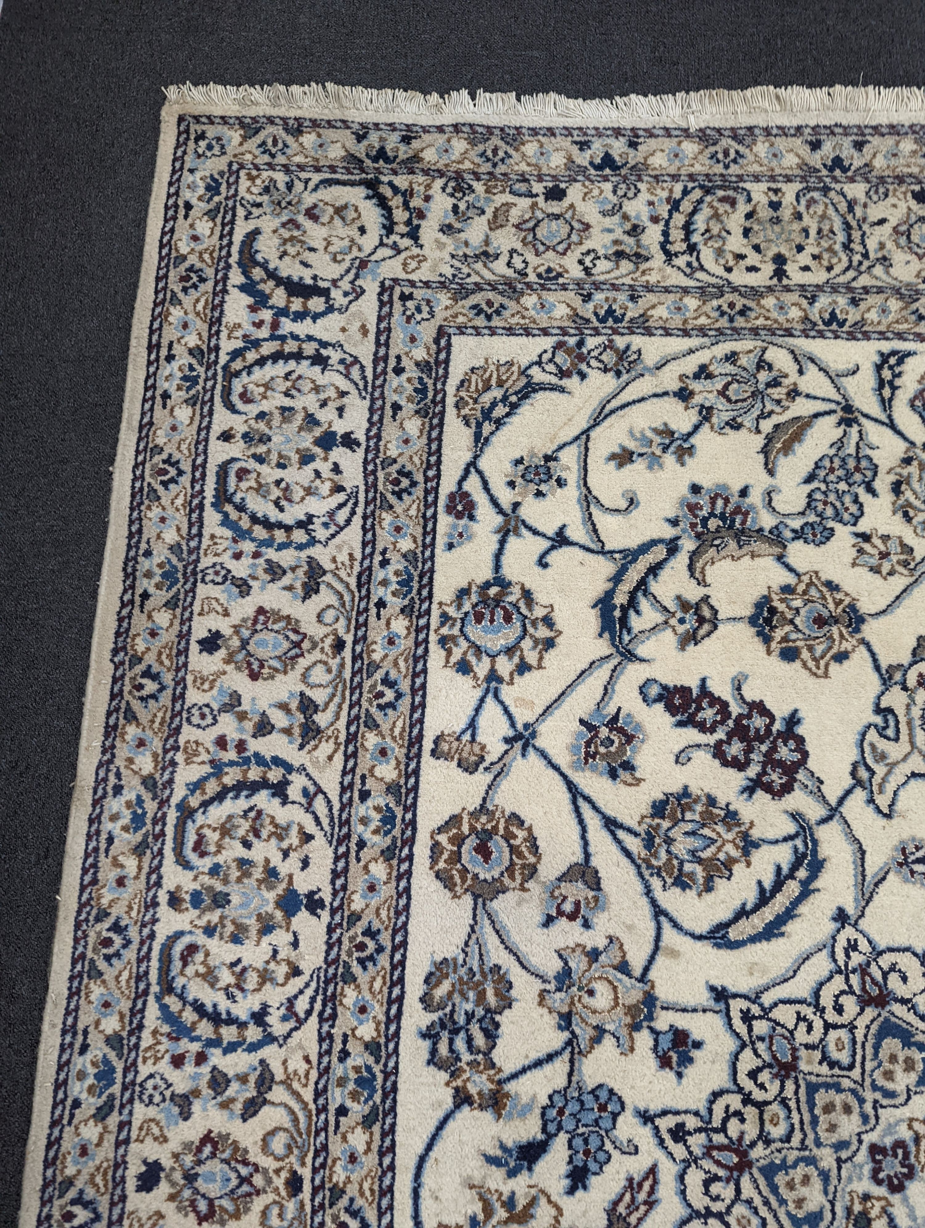 An ivory ground Nain carpet, 290 x 205cm